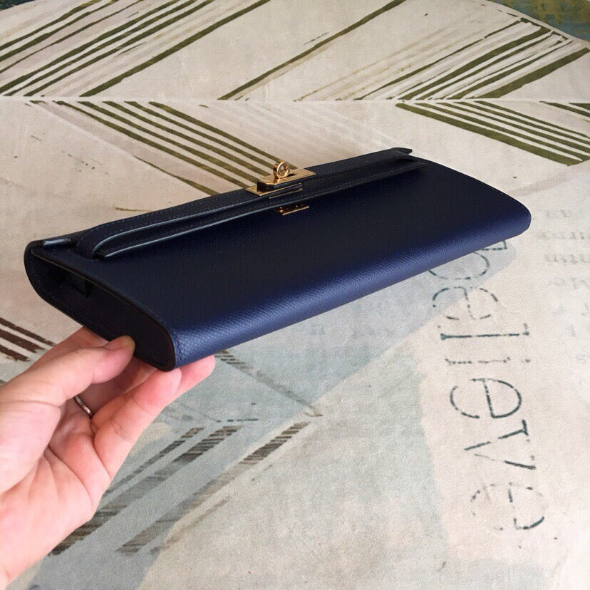 Deep Royal Navy Elongated Twist-Lock Handheld Clutch With Slim Top Grip Handle And Precise Stitch Detailing