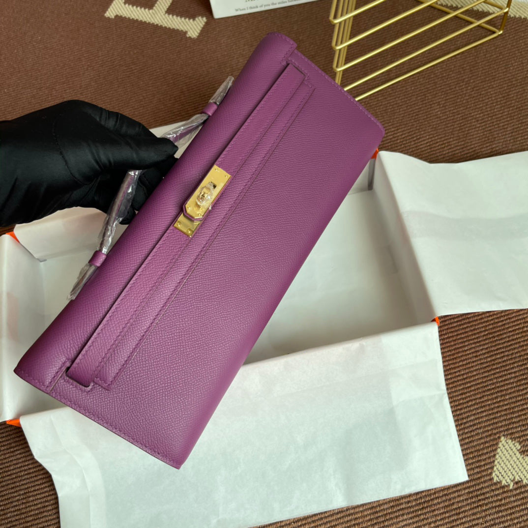 Anemone Purple Elongated Handheld Clutch With Polished Golden Twist-Lock Hardware And Slim Top Grip Handle